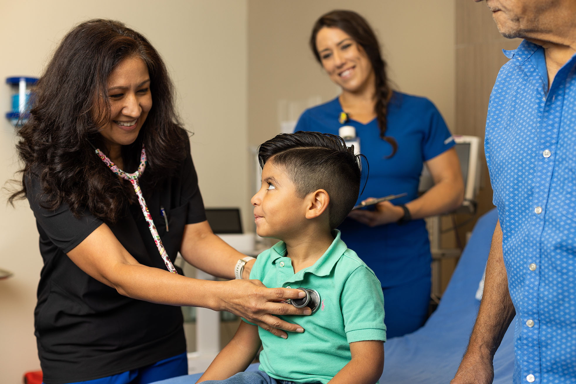 Physician, nurse and a boy patient